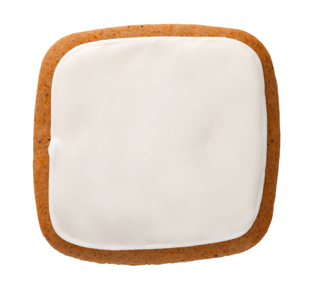 biscotto di pan di zenzero a forma di quadrato isolato - glassa foto e immagini stock