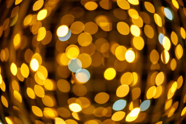 istock golden sphere shaped bokeh lights background 1294569128