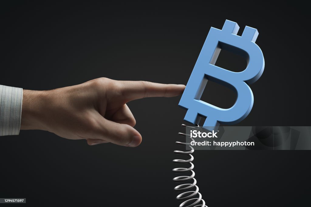 External influence on the market. Cryptocurrency volatility. Bitcoin symbol External influence on the market. Cryptocurrency volatility. Bitcoin symbol. Cryptocurrency Stock Photo