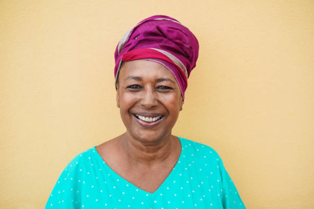 istock Happy mature african woman looking on camera - Focus on face 1294573104