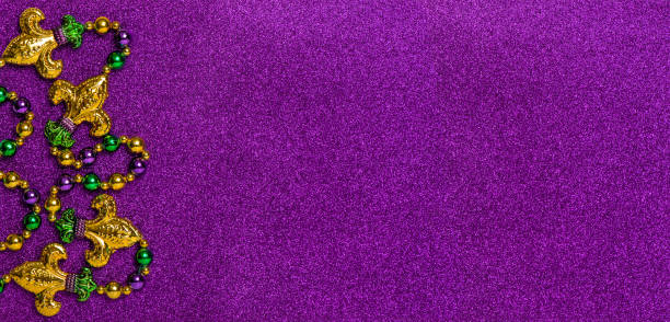 istock Carnival decoration Mardi Gras beadsglitter purple background 1294574248