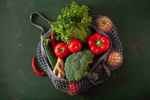 istock fruits vegetables in reusable mesh cotton bag, plastic free zero waste concept 1294575409