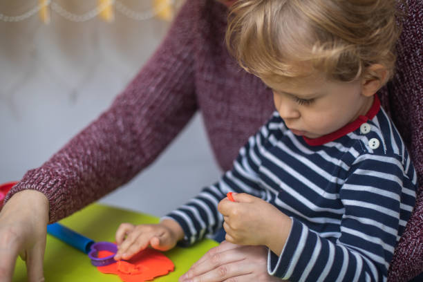 istock Cute mother and kid boy playing together 1294578078