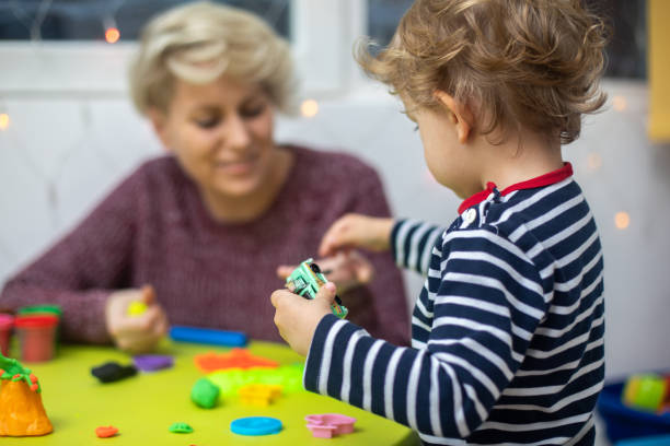 istock Cute mother and kid boy playing together 1294578478