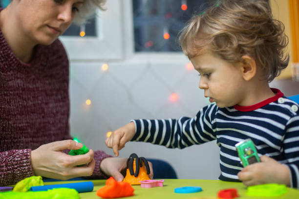 istock Cute mother and kid boy playing together 1294578491