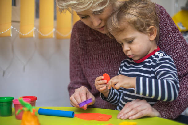 istock Cute mother and kid boy playing together 1294578540