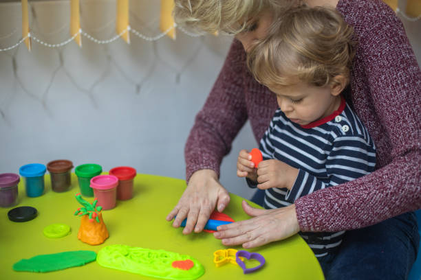istock Cute mother and kid boy playing together 1294578549