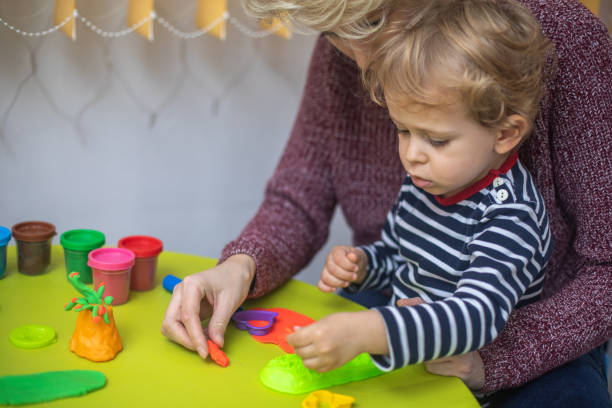 istock Cute mother and kid boy playing together 1294578573