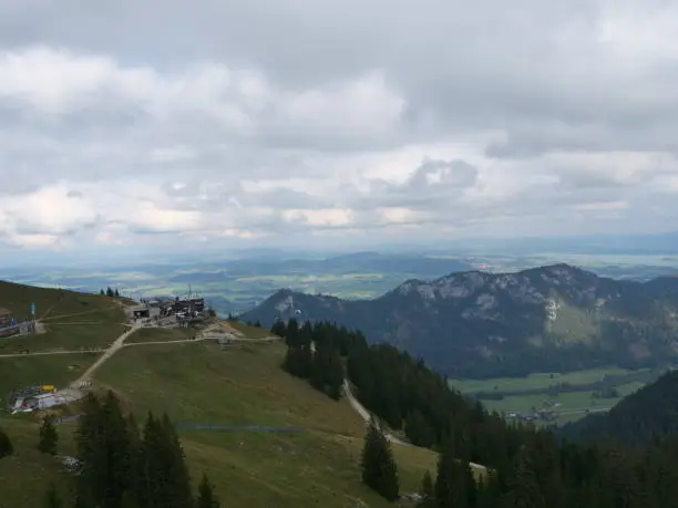Panoramic view over the mountain station of the cable car Breitenbergbahn to the Forggensee near the german town Füssen in the bavarian alps