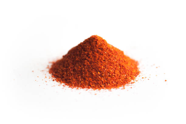 Red chili pepper powder, isolated on white background.