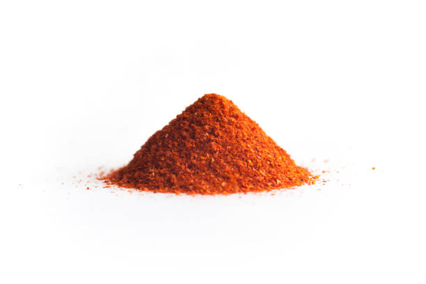 Red chili pepper powder, isolated on white background.
