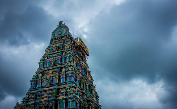 Beautiful view of the gopuram (tower) of Masani Amman Temple in Anaimalai, Pollachi, Coimbatore district of Tamil Nadu state, India. Beautiful view of the gopuram (tower) of Masani Amman Temple in Anaimalai, Pollachi, Coimbatore district of Tamil Nadu state, India. dravidian culture photos stock pictures, royalty-free photos & images