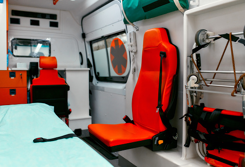 Emergency equipment and devices, Ambulance interior details. Inside an ambulance with medical equipment for helping patients before delivery to the hospital.