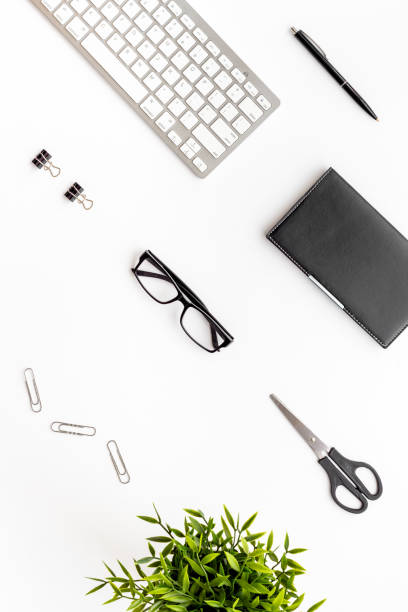 istock Flat lay office workspace with keyboard and office supplies, top view 1294583639