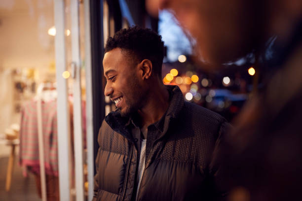 Free Stock Photo of Man looking at store window at night | Download ...