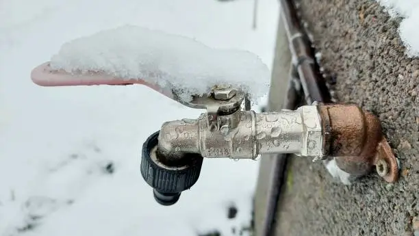 Photo of Faucet covered by snow