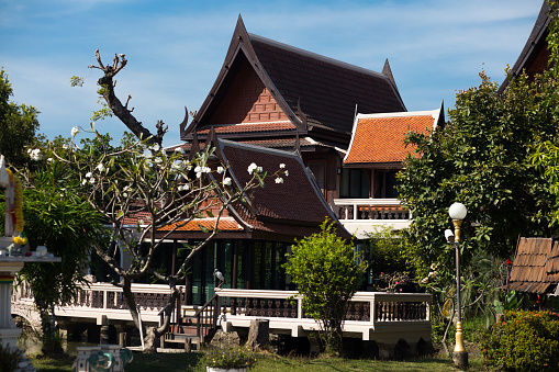 Old historical thai house with garden in Bangkok Senanikhom captured from street