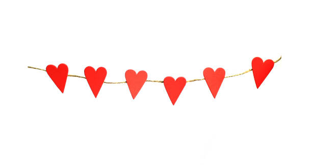 istock red hearts hanging on a rope for Valentines day 1294588766