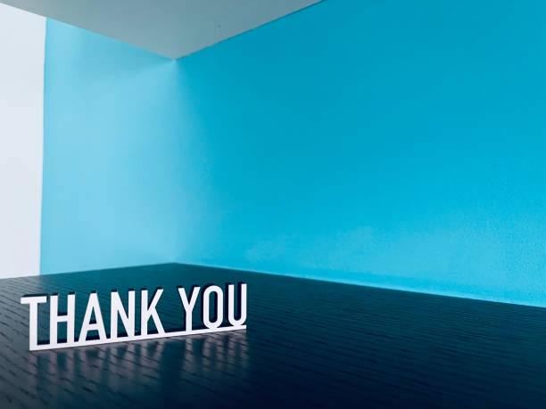 istock Thank you text on blue white background 1294593627