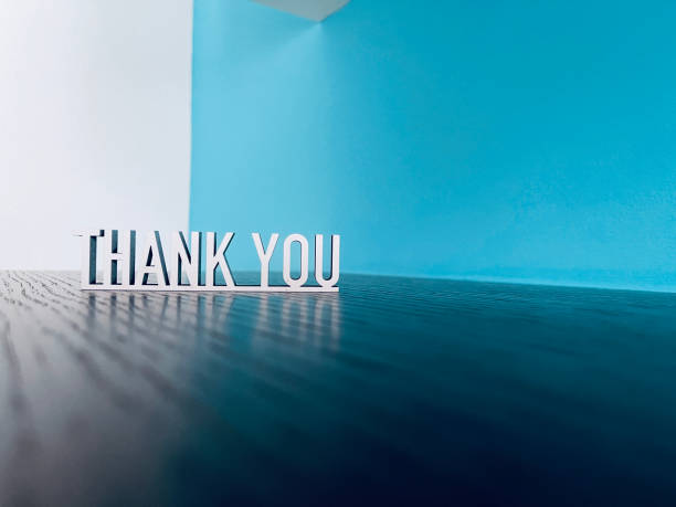 istock Thank you text on blue white background 1294593843