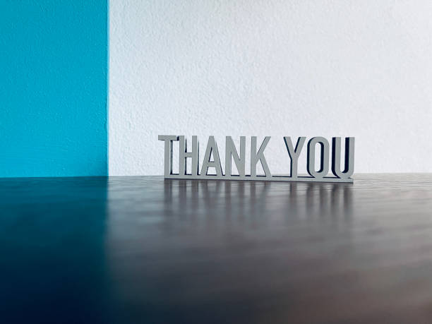 istock Thank you text on blue white background 1294594224