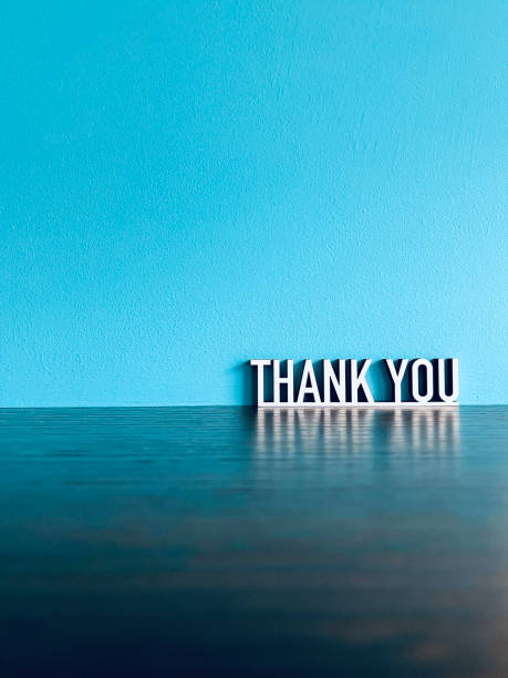 Thank you text on blue  background stock photo