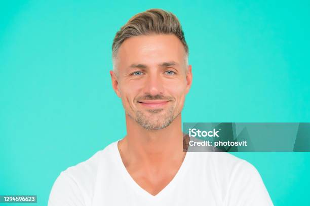 Smiling Guy With Trendy Hairstyle Has Colored Graying Hair And Groomed Face  On Turquoise Background Personal Care Stock Photo - Download Image Now -  iStock