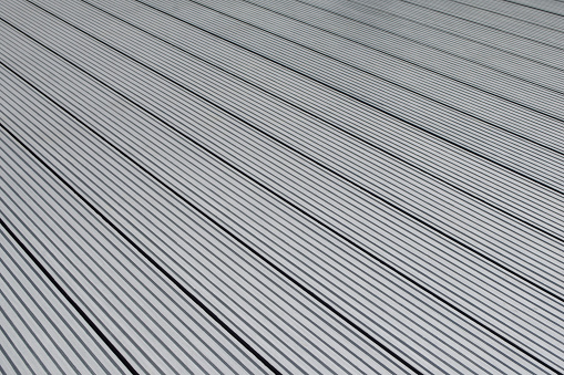 Dark gray or anthracite wpc material composite board deck for the construction of terrace.
