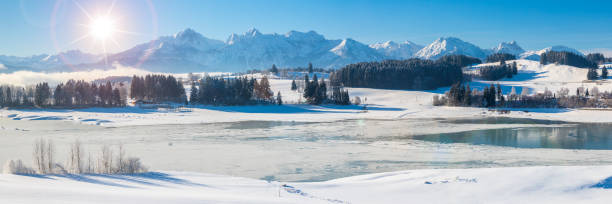 istock beautiful panoramic landscape with mountain range in Bavaria, Germany, at cold winter day 1294598819