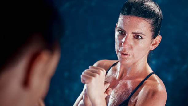 istock Female fighter in fighting stance 1294598890