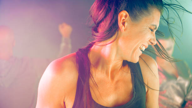 istock Woman dancing in night club 1294599045