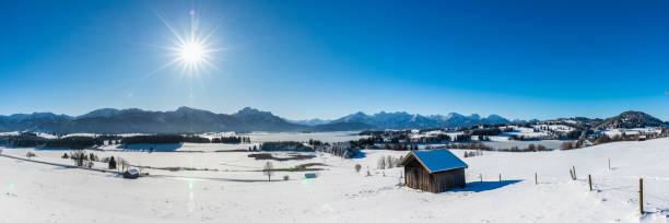 istock beautiful panoramic landscape with mountain range in Bavaria, Germany, at cold winter day 1294599906