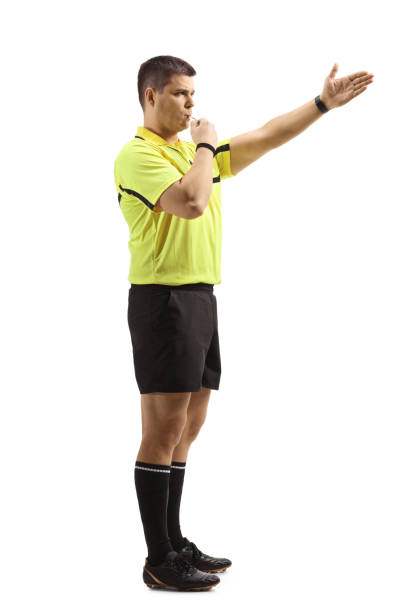 istock Football referee using a whistle and pointing with his hand 1294601725