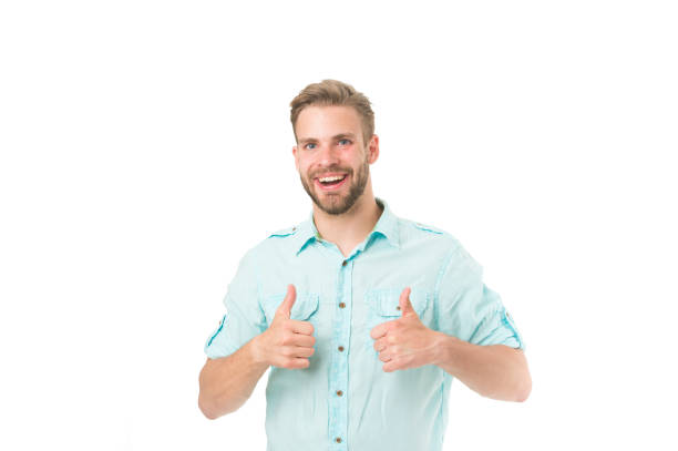 Highly recommend. Guy shows thumbs up gesture. Man confidently highly recommend white background. Guy with bristle recommend excellent item. Man shop consultant looks confident and hospitable.