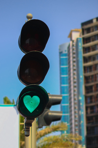 Traffic lights with heart shaped green light. Ajman, UAE