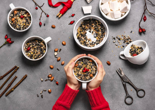 istock Step 2. Child filling all cups with birdseeds. 1294608737
