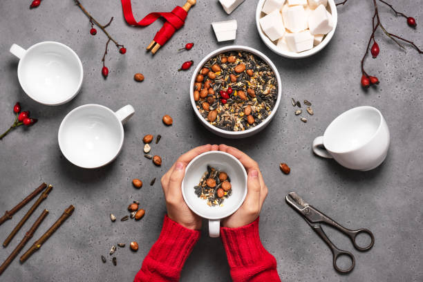 istock Step 1. Child filling the cup with peanuts and birdseeds. 1294608853