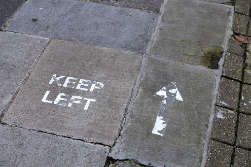 Keep left sign on a pavement in Cambridge during the pandemic of 2020.
