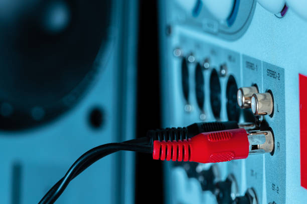 Rear panel of music system amplifier with wires close up