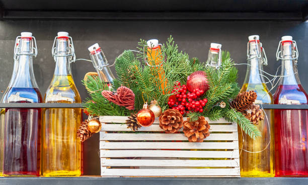 Street decoration with bottles and Christmas tree branches.