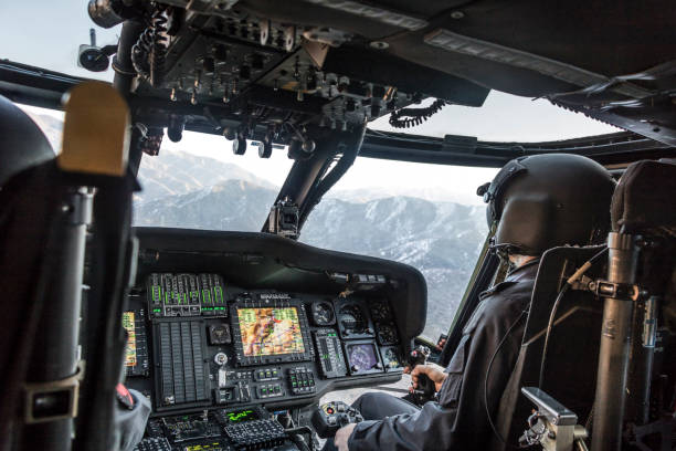 istock Army pilot riding military helicopter 1294611864