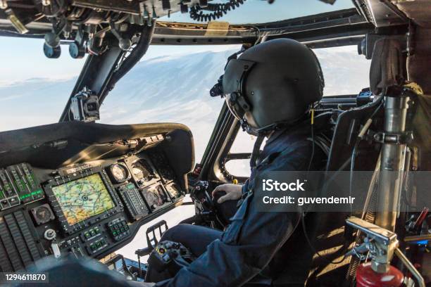 Army Pilot Riding Military Helicopter Stock Photo - Download Image Now - Pilot, Cockpit, Piloting