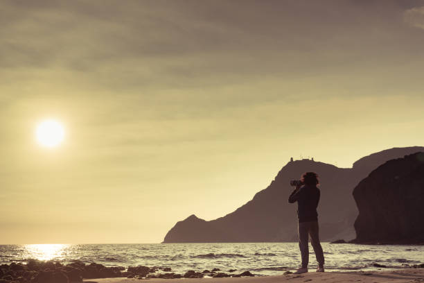 istock Woman with camera on Monsul beach, Spain 1294611938