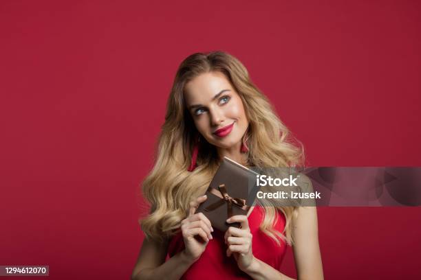 Beautiful Woman Holding Gift Box Stock Photo - Download Image Now - One Woman Only, Women, Gift