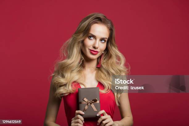 Beautiful Woman Holding Gift Box Stock Photo - Download Image Now - Women, Gift, Gift Box