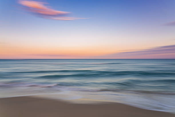 istock Palm Beach Island beach sunset with slow shutter pan 1294613844