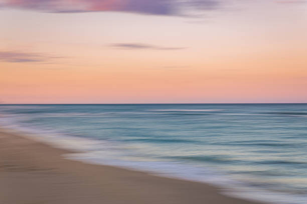 istock Palm Beach Island beach sunset with slow shutter pan 1294613845