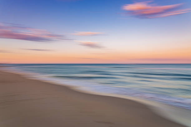 istock Palm Beach Island beach sunset with slow shutter pan 1294613846