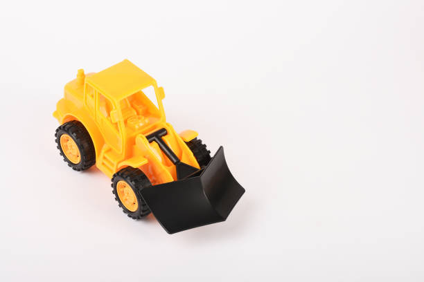 istock Toy bulldozer construction vehicle on the white background 1294614030