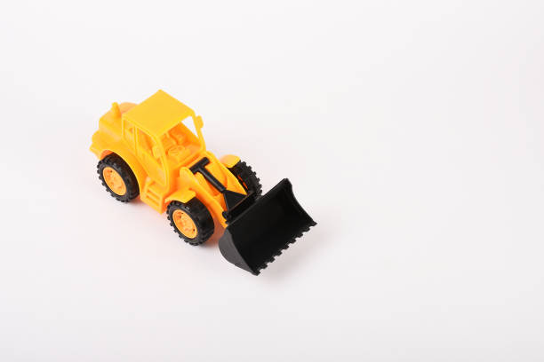 istock Toy bulldozer construction vehicle on the white background 1294615023